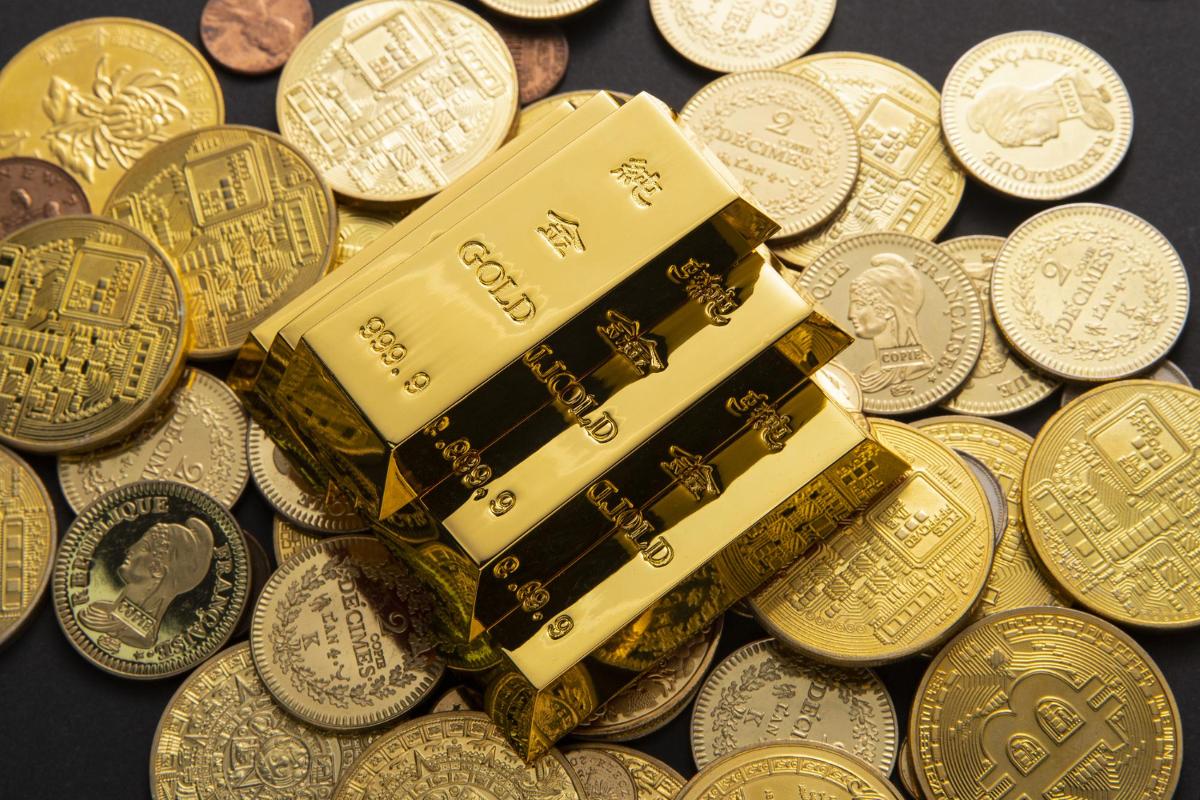 https://www.bomdiamercado.com.br/wp-content/uploads/2023/11/moedas-e-ouro-commodity.jpg
